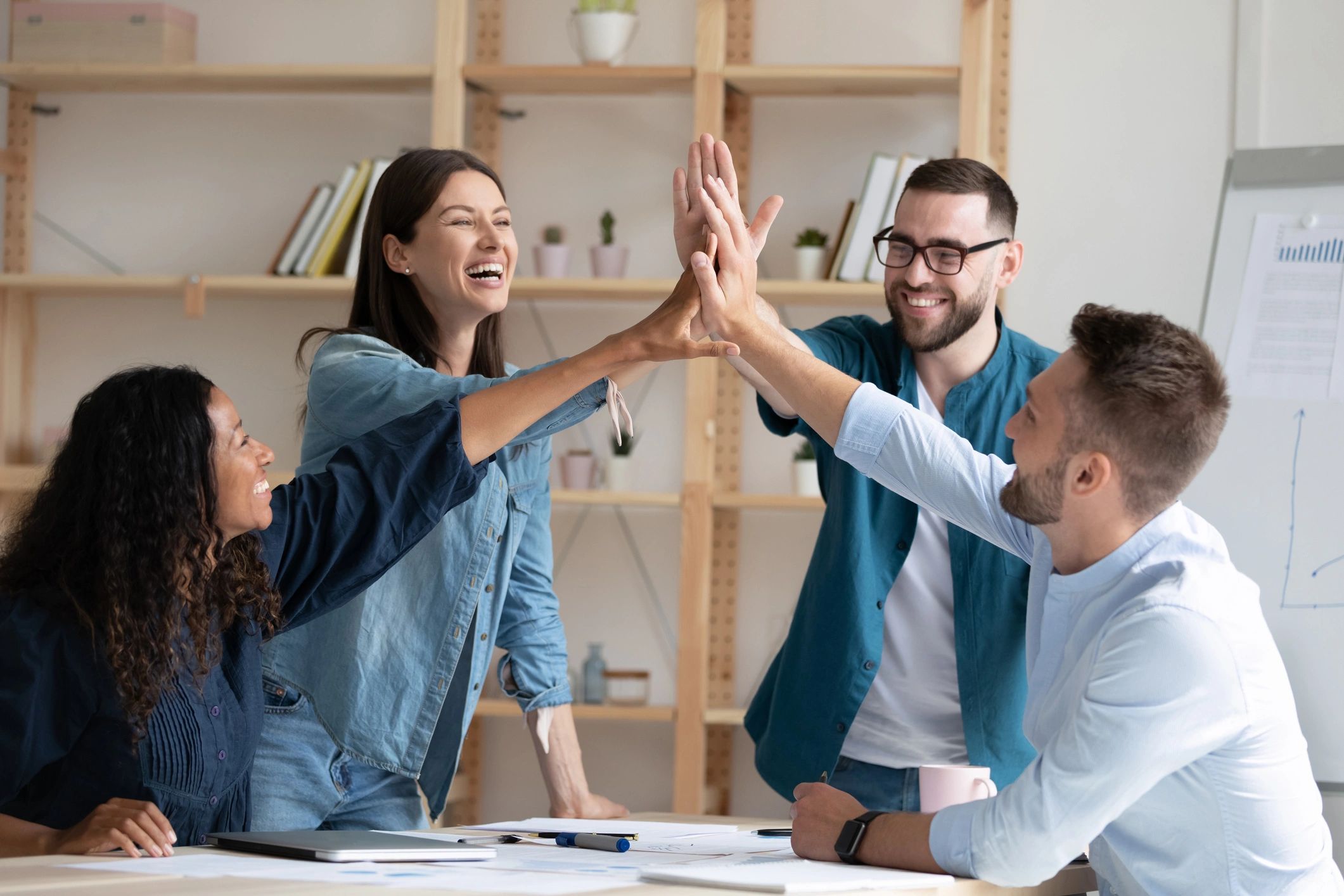 diverse professionals celebrating success tech training