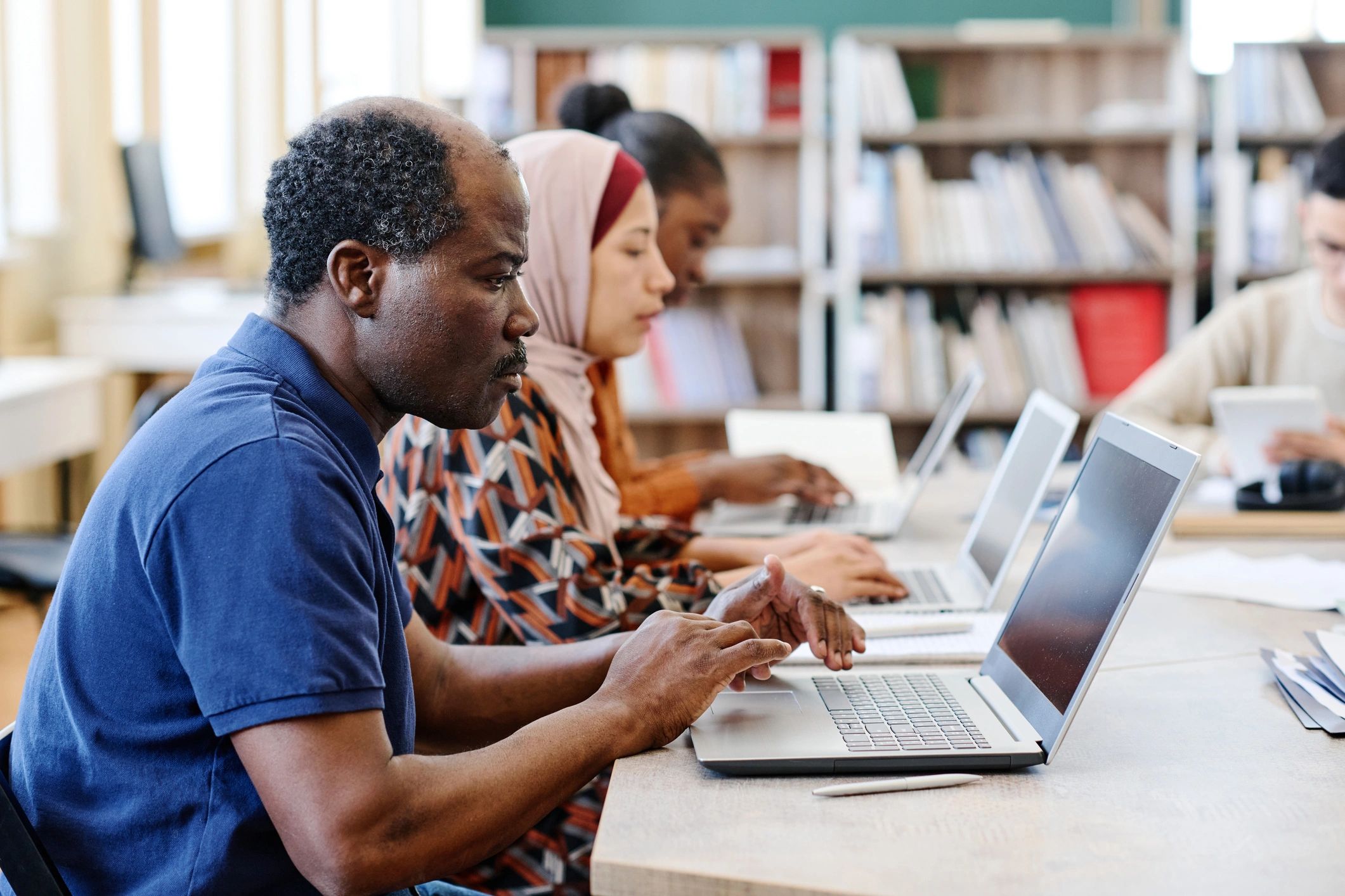 diverse people learning technology online modern