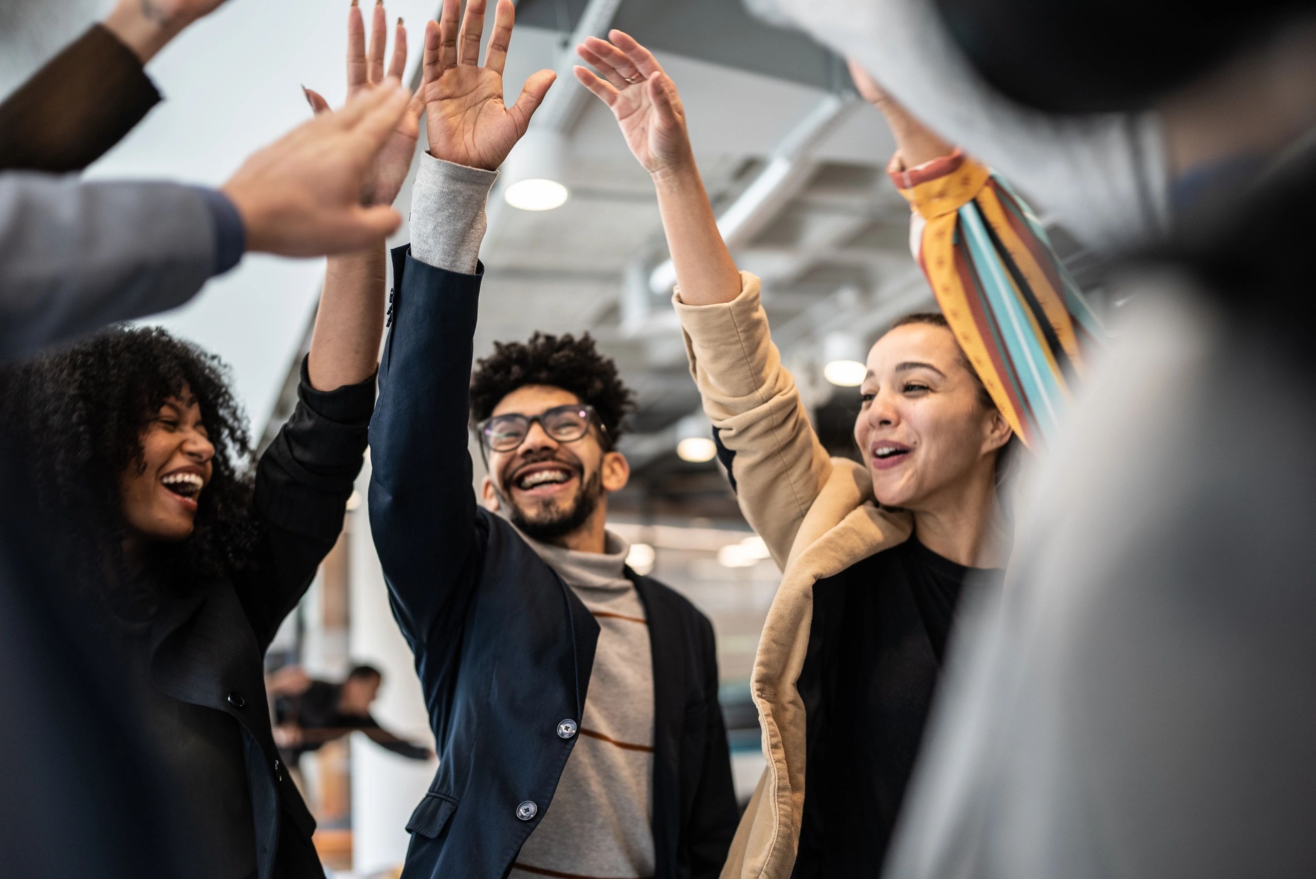 diverse professionals celebrating success tech training