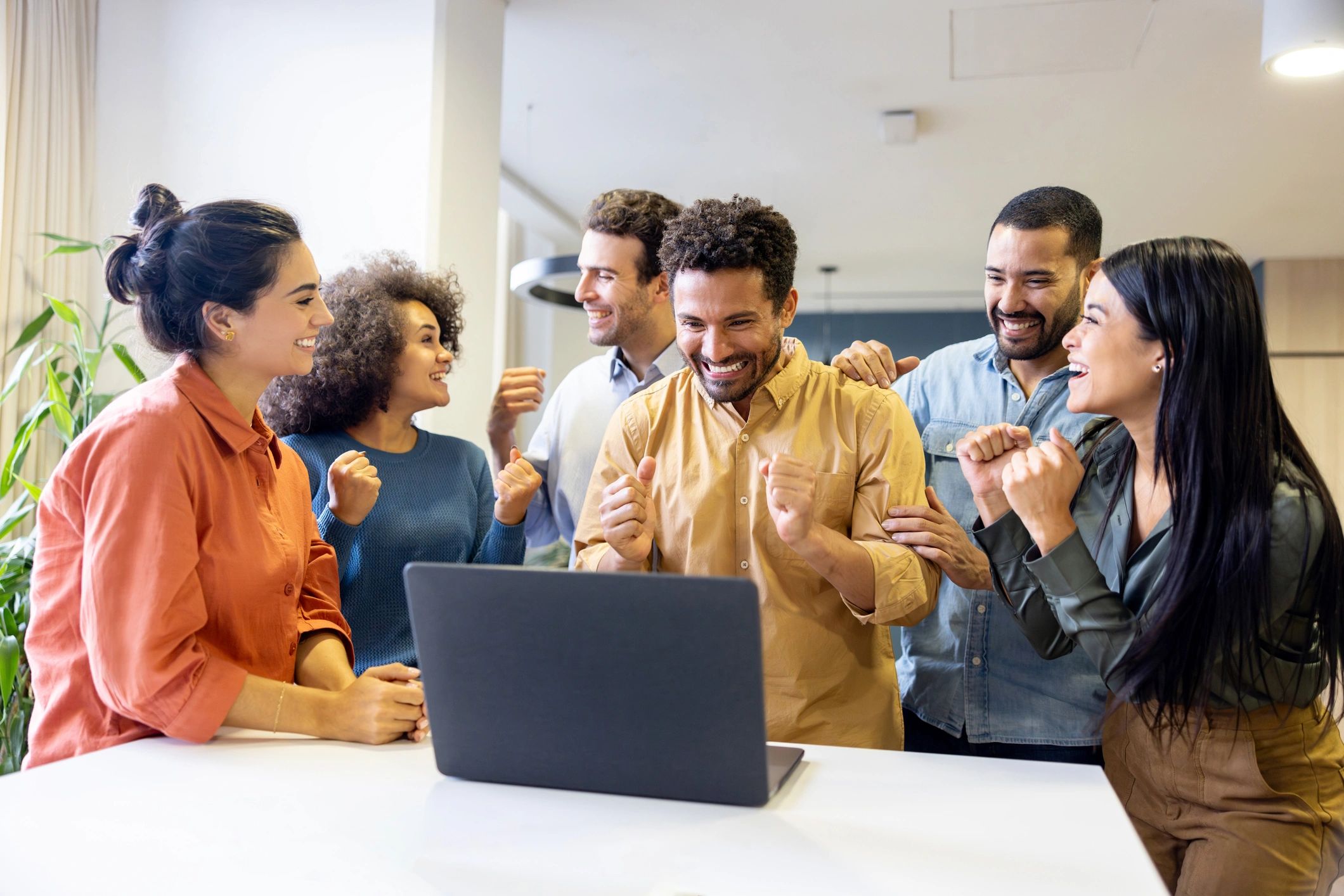 diverse professionals celebrating success tech training