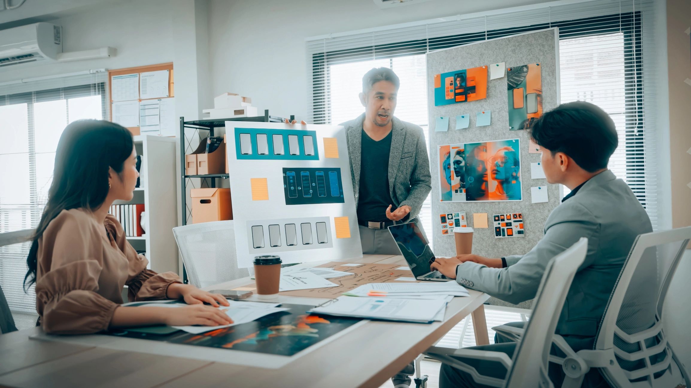 product manager collaborating with team roadmap modern office
