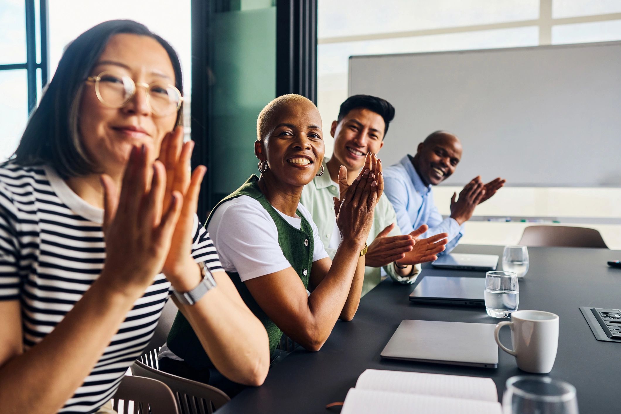 diverse professionals celebrating success tech training